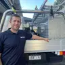 Allan Cameron of AC Plumbing and Drainage beside the work ute